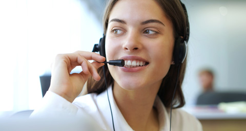 Customer service agent on the telephone with a customer.